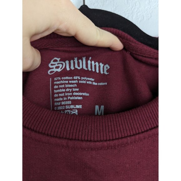 Red Crew Neck Sweater with Vibrant Graphic Design - Picture 2 of 6